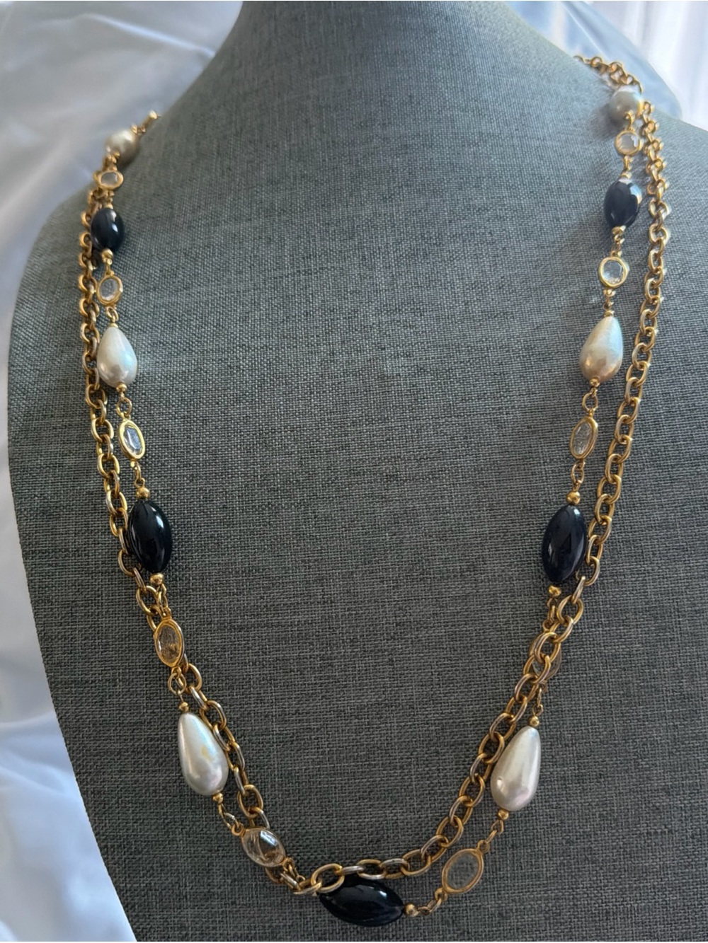 Premier Designs necklace features a distinctive gold-tone tag